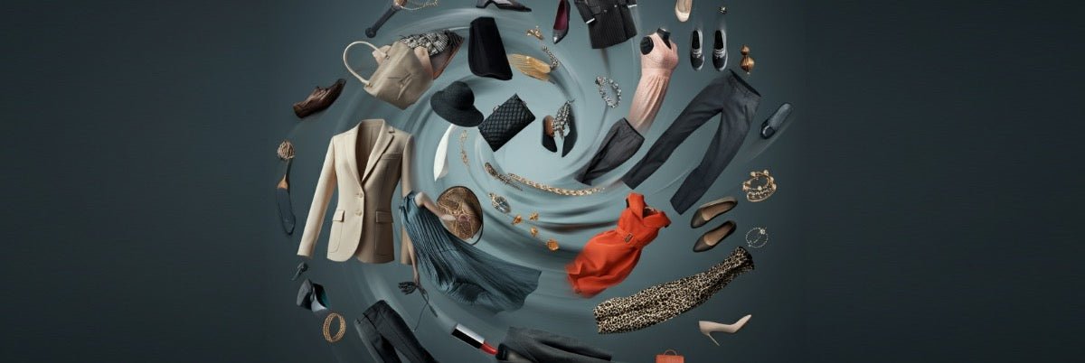Dynamic photograph of high-end fashion items, including clothing, shoes, and accessories, swirling against a dark background, symbolizing movement, abundance, and luxury.